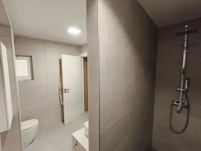a bathroom with a toilet and a shower at Valencia City Premium Terrace Apartment in Valencia