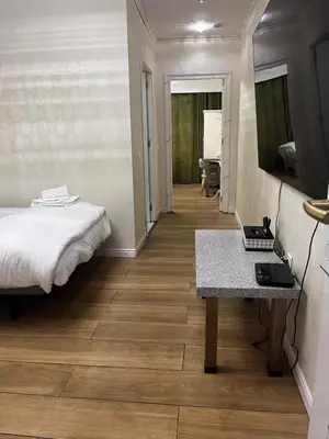 a hallway with a glass elevator in a building at air hotel aviacion in Valencia