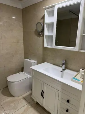 a room with three beds and a tv in it at air hotel aviacion in Valencia