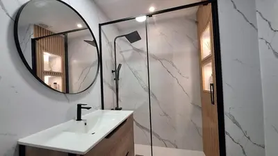a bathroom with a sink and a mirror at Chalet adosado junto al mar en Almarda Sagunto in Almarda