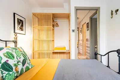 a bedroom with a bed and a door to a hallway at Casa Rosa Longterm Living and Workspace in Monserrat