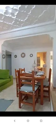 a dining room with a wooden table and chairs at Valencia city in Valencia