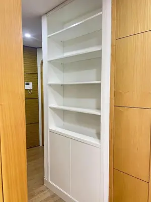 a closet with white shelves in a room at Heart of Valencia in Valencia