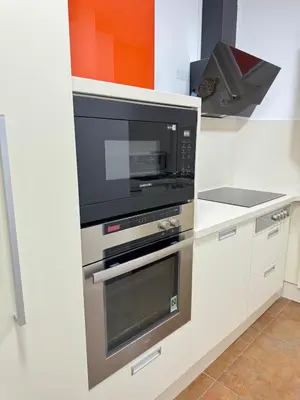 a kitchen with a microwave and a oven at Heart of Valencia in Valencia