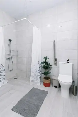a white bathroom with a toilet and a shower at N4 Comfortable & bright apartament Park Benicalap in Valencia