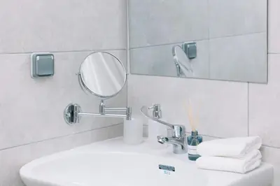 a bathroom with a sink and a mirror at N4 Comfortable & bright apartament Park Benicalap in Valencia