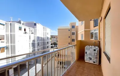 a balcony of a apartment with a suitcase at Lovely Apartment In Tavernes De La Valldig in Tavernes de Valldigna
