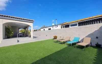 a group of chairs sitting on a lawn at Awesome Home In Olocau in Olocau