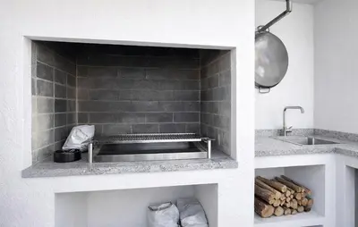 a kitchen with a sink and a counter with logs at Awesome Home In Olocau in Olocau