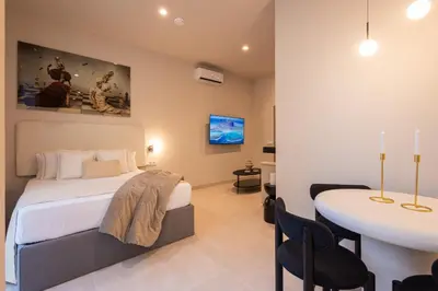 a bedroom with a bed and a table in a room at Loft Valencia - B 1-6 Smart Access & Urban Calm in Valencia