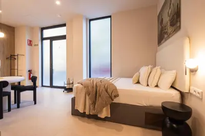 a bedroom with a bed with a view of the ocean at Loft Valencia - B 1-6 Smart Access & Urban Calm in Valencia