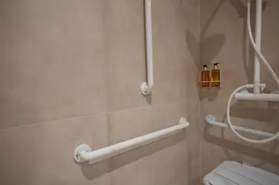 a bathroom with a toilet and towel bars at Loft Valencia - B 1-6 Smart Access & Urban Calm in Valencia