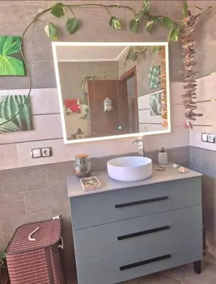 a bathroom with a sink and a mirror at Acogedor y exótico hogar con piscina privada in Rafelguaraf
