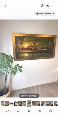 a picture of a painting hanging on a wall at Acogedor y exótico hogar con piscina privada in Rafelguaraf