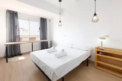 a bedroom with a bed with two towels on it at Modern 2BR in Beautiful Burriana in Burriana
