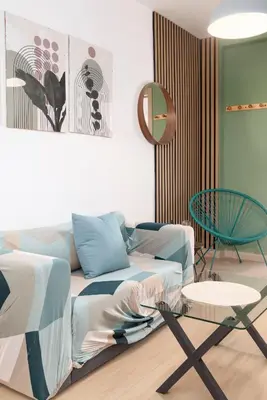 a living room with a couch and a table at Modern 2BR in Beautiful Burriana in Burriana