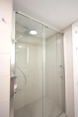 a shower with a glass door in a bathroom at Vistas al Mar in Puerto de Sagunto