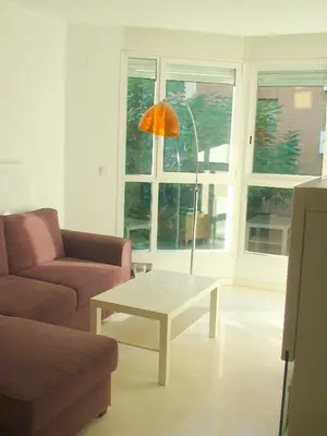 a living room with a coffee table and an orange umbrella at Mestalla Silence in Valencia