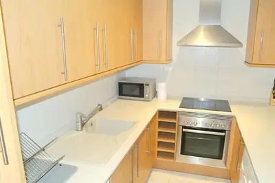 a kitchen with a sink and a microwave at Mestalla Silence in Valencia