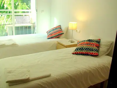 a bedroom with two beds with pillows and a window at Mestalla Silence in Valencia
