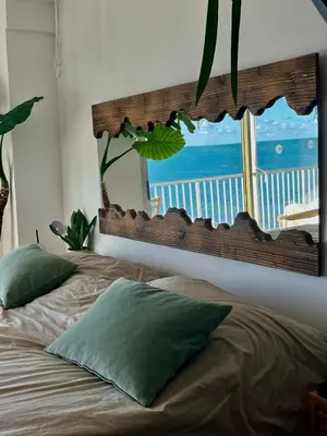 a bedroom with a bed with a view of the ocean at Apartamento tranquilo y luminoso junto al mar in Cullera