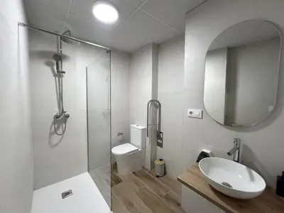 a bathroom with a toilet and a sink and a shower at Loft Valencia TR28 - Ground & Arts Connected in Valencia