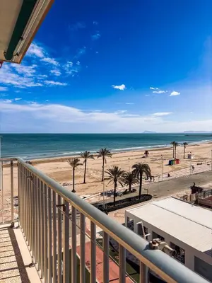 a balcony with a view of a beach and the ocean at Primera línea en playa de Cullera in Cullera