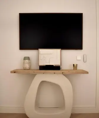 a tv sitting on top of a desk with a monitor on it at Stylish & Cozy Flat in heart of Eixample, Valencia in Valencia