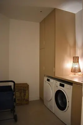 a washing machine in a kitchen with a lamp at Stylish & Cozy Flat in heart of Eixample, Valencia in Valencia