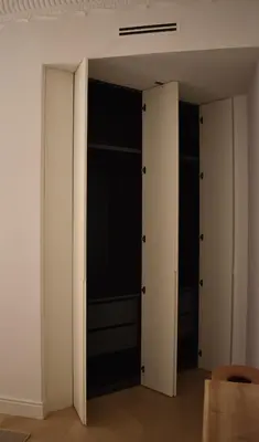 a room with two closets with black and white walls at Stylish & Cozy Flat in heart of Eixample, Valencia in Valencia