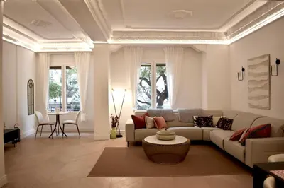 a living room with a couch and a table at Stylish & Cozy Flat in heart of Eixample, Valencia in Valencia