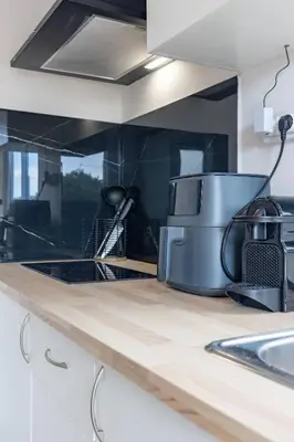 a kitchen counter with a toaster and a sink at Tiny House Long-term remote work near Valencia in Monserrat