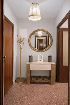 a small kitchen with a bed and a refrigerator at Central Home Coliving - vive en la zona de moda del centro de Valencia in Valencia