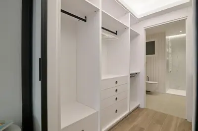 a white walk in closet in a bathroom at Luxury Romantic Apartment Mestalla by Virkin Suites in Valencia