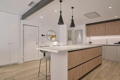 a kitchen with a large white counter and a sink at Luxury Romantic Apartment Mestalla by Virkin Suites in Valencia