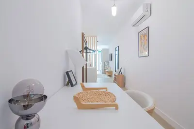 a white room with a counter with a mortar and pestle at NOMAD Viveros 01 in Valencia