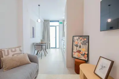 a living room with a couch and a table at NOMAD Viveros 01 in Valencia