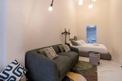 a living room with a couch and a bed at Studio 03 - Les artes in Valencia