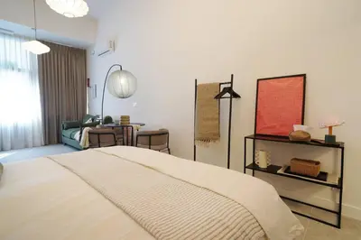 a bedroom with a bed and a living room at Studio 01 - Les Artes in Valencia