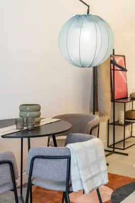 a room with chairs and a table with a lamp at Studio 01 - Les Artes in Valencia