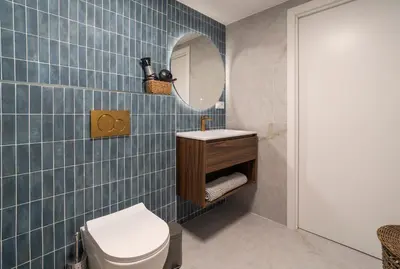 a bathroom with a toilet and a mirror at Studio 02 - Les Artes in Valencia