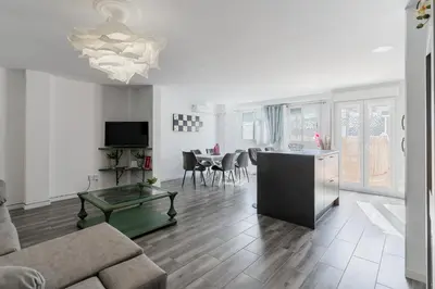 a living room with a couch and a table at Modern 2BR Apartment with Terrace in Valencia in Valencia