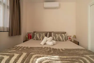 a bedroom with a bed with two stuffed animals on it at República Argentina 02 in Valencia