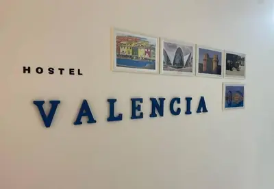 a sign for a museum with pictures on a wall at Hostel valencia ruzafa in Valencia