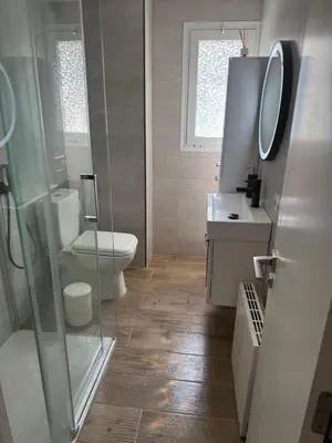 a bathroom with a toilet and a glass shower at Chalet Piscina Privada in Barraca de Aguas Vivas