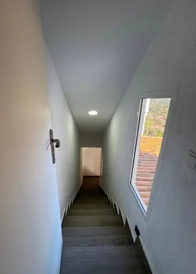 a stairway with a window on the side of a building at Chalet Piscina Privada in Barraca de Aguas Vivas