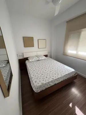 a small bedroom with a bed and a window at Chalet Piscina Privada in Barraca de Aguas Vivas