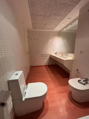 a bathroom with a toilet and a sink and a mirror at Relaxing Sea View Apartment - Patacona Beach in Valencia