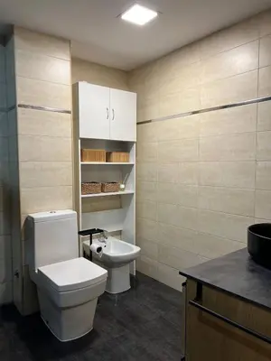 a bathroom with a toilet and a sink at Pearl by the sea in Valencia