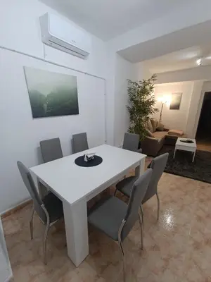 a white table and chairs in a living room at Casa el Pato Lolo in Bolbaite